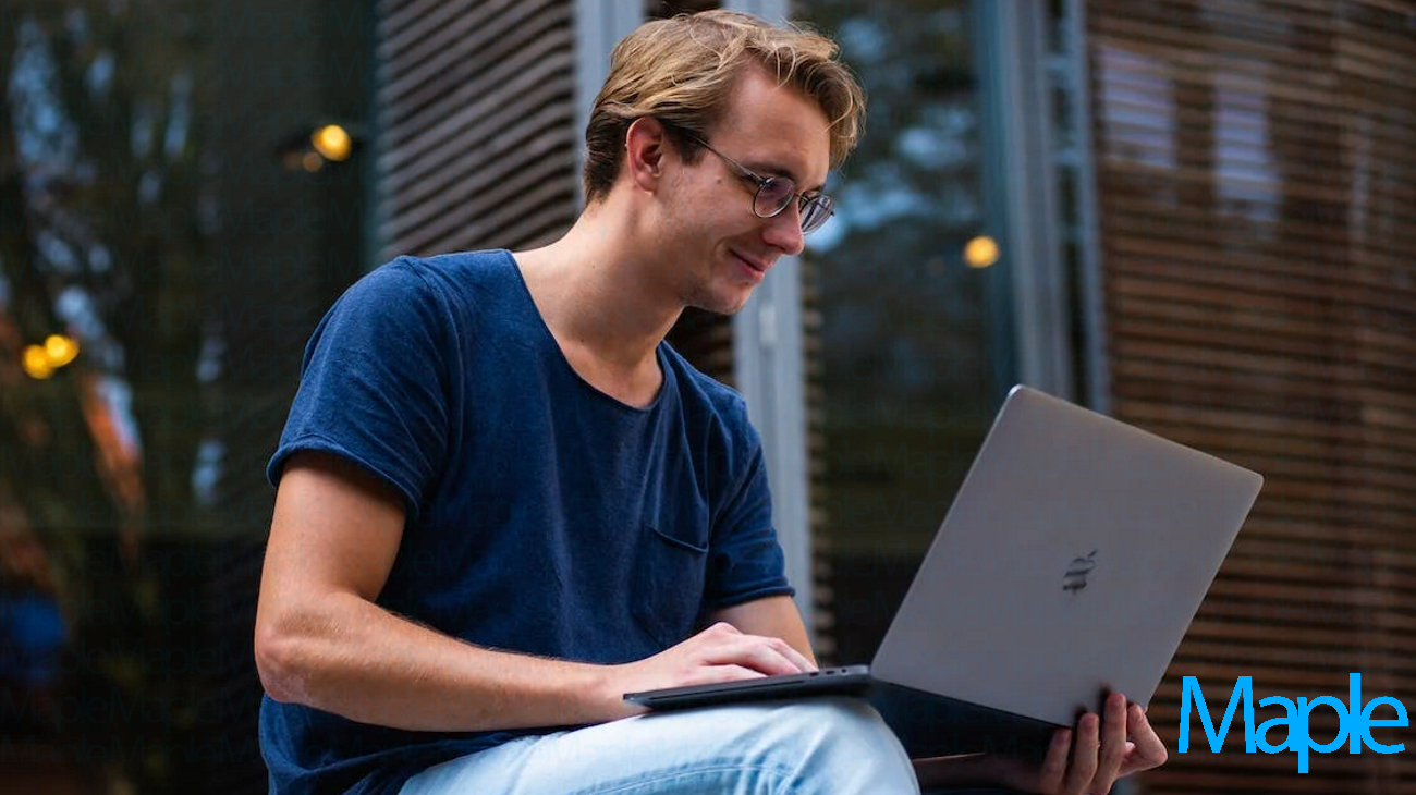 Man on a Refurbished MacBook