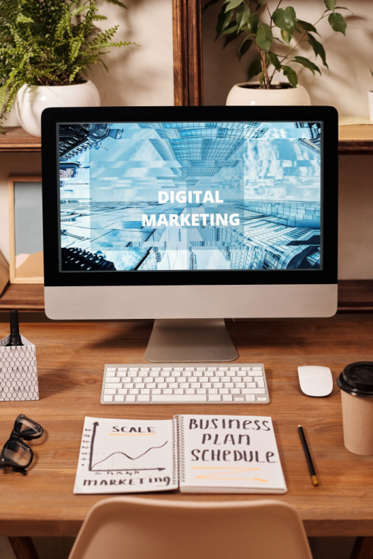 An iMac with Digital Marketing displayed on the screen. This is to demonstrate affiliate marketers planning and considering which merchants to advertise.